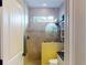 Charming bathroom with a shower, toilet and granite countertop at 170 Antilla Dr, Rotonda West, FL 33947