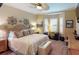 Cozy bedroom with a queen-size bed and bay window at 170 Antilla Dr, Rotonda West, FL 33947