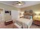 Serene bedroom with a queen-size bed and nautical decor at 170 Antilla Dr, Rotonda West, FL 33947