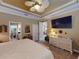 Bright bedroom featuring a king-size bed and large TV at 170 Antilla Dr, Rotonda West, FL 33947