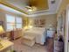 Spacious bedroom with king-size bed and wicker furniture at 170 Antilla Dr, Rotonda West, FL 33947