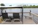 Enjoy the view from this lakeside dock, complete with a swinging bench at 170 Antilla Dr, Rotonda West, FL 33947