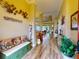 Inviting entryway with built-in bench and view to living area at 170 Antilla Dr, Rotonda West, FL 33947