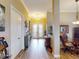 Light and airy entryway with hardwood floors and double French doors at 170 Antilla Dr, Rotonda West, FL 33947