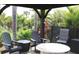 Relaxing gazebo with seating and fire pit at 170 Antilla Dr, Rotonda West, FL 33947