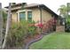 Well-manicured landscaping accents this charming house exterior at 170 Antilla Dr, Rotonda West, FL 33947