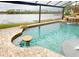 Relaxing pool area with lake view and swim-up bar at 170 Antilla Dr, Rotonda West, FL 33947