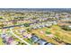 Wide aerial view showcasing home's location in a golf course community at 197 Bunker Rd, Rotonda West, FL 33947