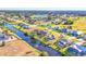 Aerial view of a single-Gathering home with a canal and golf course nearby at 197 Bunker Rd, Rotonda West, FL 33947