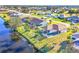 Aerial view of canal front home with private pool and lush landscaping at 197 Bunker Rd, Rotonda West, FL 33947