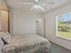 Bedroom with queen bed, walk-in closet, and backyard view at 197 Bunker Rd, Rotonda West, FL 33947