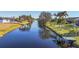 Aerial view showcasing a peaceful canal and neighborhood homes at 197 Bunker Rd, Rotonda West, FL 33947