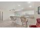 Kitchen features a breakfast bar and access to the living room at 197 Bunker Rd, Rotonda West, FL 33947
