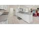 Well-equipped kitchen with white cabinetry and a breakfast bar at 197 Bunker Rd, Rotonda West, FL 33947