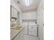 Laundry room with washer, dryer, and utility sink at 197 Bunker Rd, Rotonda West, FL 33947