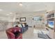 Bright living room with comfy seating and a large TV at 197 Bunker Rd, Rotonda West, FL 33947