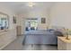 Main bedroom with a king-size bed and sliding door access to the pool at 197 Bunker Rd, Rotonda West, FL 33947