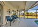 Covered patio with seating area, overlooking the pool and canal at 197 Bunker Rd, Rotonda West, FL 33947