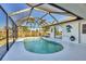 Relaxing kidney-shaped pool with a screened enclosure at 197 Bunker Rd, Rotonda West, FL 33947