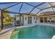 Screened-in pool with backyard and canal view at 197 Bunker Rd, Rotonda West, FL 33947
