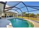 Screened-in pool with backyard and canal view at 197 Bunker Rd, Rotonda West, FL 33947