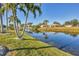 Peaceful waterfront view with canal access and lush landscaping at 197 Bunker Rd, Rotonda West, FL 33947