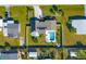 Aerial view showcasing home, pool, and surrounding landscape at 221 E Wentworth St, Englewood, FL 34223