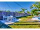 Relaxing patio area with table and chairs, overlooking the grassy backyard at 221 E Wentworth St, Englewood, FL 34223