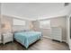 Main bedroom with king-size bed and light blue bedding at 221 E Wentworth St, Englewood, FL 34223