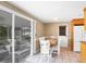Kitchen with wood cabinets, granite countertops and eat-in area at 221 E Wentworth St, Englewood, FL 34223