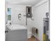 Laundry room with washer, dryer, and ample storage at 221 E Wentworth St, Englewood, FL 34223