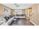 Living room featuring neutral decor, light floors and a view of the patio at 221 E Wentworth St, Englewood, FL 34223