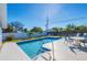 Inviting backyard pool with patio furniture at 221 E Wentworth St, Englewood, FL 34223