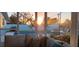 Sunset view of the pool from a covered patio with comfortable seating at 221 E Wentworth St, Englewood, FL 34223