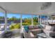 Spacious screened patio with sectional sofa and view at 221 E Wentworth St, Englewood, FL 34223
