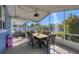 Relaxing screened patio with seating and pool view at 221 E Wentworth St, Englewood, FL 34223