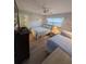Guest bedroom with two twin beds and light decor at 244 Saint Augustine Ave # 102, Venice, FL 34285