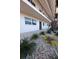 Exterior view of condo building showcasing landscaping and building features at 244 Saint Augustine Ave # 102, Venice, FL 34285
