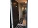 Interior view of condo entryway, tiled floors and open door at 244 Saint Augustine Ave # 102, Venice, FL 34285