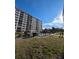 Building exterior showcasing landscaping and pool at 244 Saint Augustine Ave # 102, Venice, FL 34285