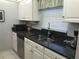 Modern kitchen with stainless steel appliances and granite countertops at 244 Saint Augustine Ave # 102, Venice, FL 34285
