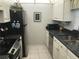 Modern kitchen with stainless steel appliances and granite countertops at 244 Saint Augustine Ave # 102, Venice, FL 34285