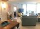 Living room with comfortable seating and views to bedroom and balcony at 244 Saint Augustine Ave # 102, Venice, FL 34285