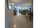 Bright living room with tile floors, comfy seating, and dining area at 244 Saint Augustine Ave # 102, Venice, FL 34285