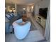 Bright living room with comfy seating and large TV at 244 Saint Augustine Ave # 102, Venice, FL 34285