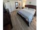 King-size bed in the main bedroom at 244 Saint Augustine Ave # 102, Venice, FL 34285