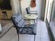 Small patio with two chairs and a side table at 244 Saint Augustine Ave # 102, Venice, FL 34285