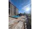 Inviting pool area with lounge chairs and patio furniture at 244 Saint Augustine Ave # 102, Venice, FL 34285