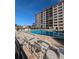 Community pool with surrounding lounge chairs at 244 Saint Augustine Ave # 102, Venice, FL 34285