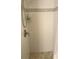 Clean shower with white tile walls and pebble floor at 244 Saint Augustine Ave # 102, Venice, FL 34285